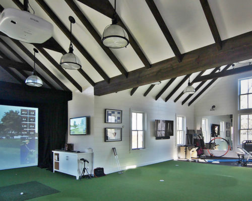 man cave golf house with indoor golf facility