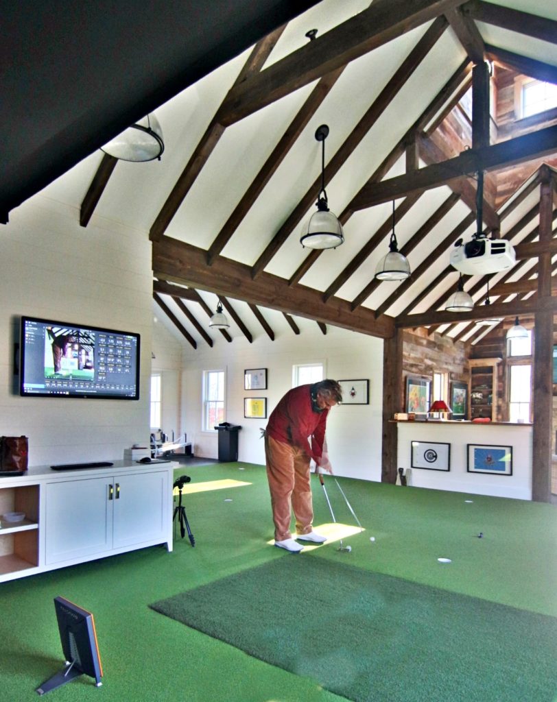 man cave golf house with indoor golf facility