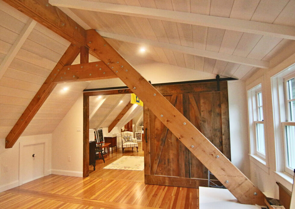 attic-office-transformation-with-high-ceiling-and-industrial-beam-detail