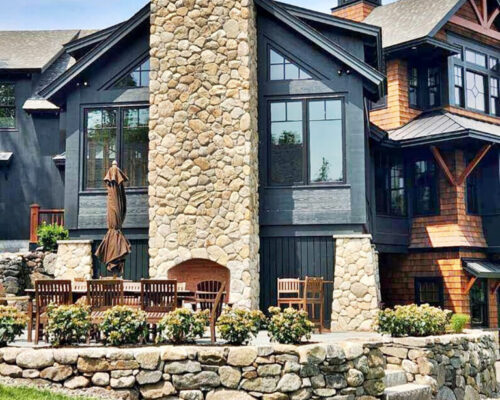 northshore-ma-home-with-lakehouse-style-addition-and-stone-chimney